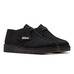 Black suede shoe with 'Clarks Originals' logo on a white background