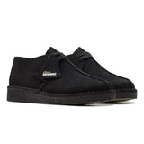 Black suede shoe with 'Clarks Originals' logo on a white background